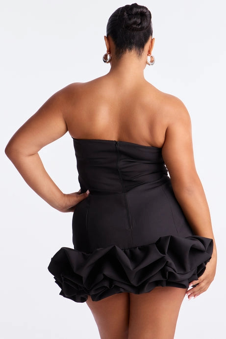 Plus size black strapless homecoming dress with center back zipper and ruffled bubble hem