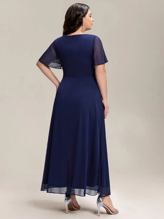 Navy blue plus size evening gown back view, round back neck, center back zipper, flutter sleeves and flowing chiffon long skirt