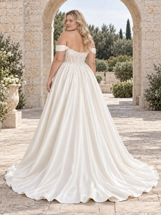 Ivory plus size wedding dress with button-style back, off-shoulder draped sleeves, structured corset and flowing satin train