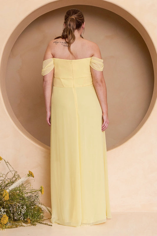 Back view of plus size butter yellow bridesmaid dress featuring draped off-shoulder sleeves, straight back, center zipper and flowing A-line skirt by roselledress.