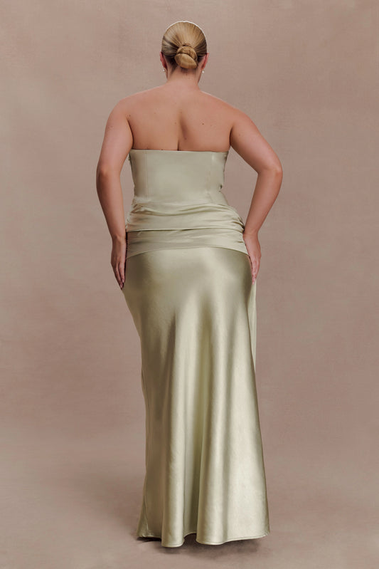 Sage green plus size strapless evening dress with straight back neckline, ruched waist, fitted hips and floor-length mermaid skirt back view