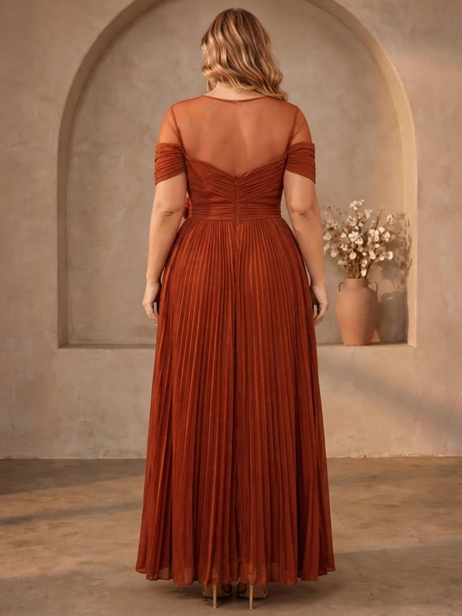 Sheer mesh back zipper detail of burnt‑orange curvy pleated formal prom gown