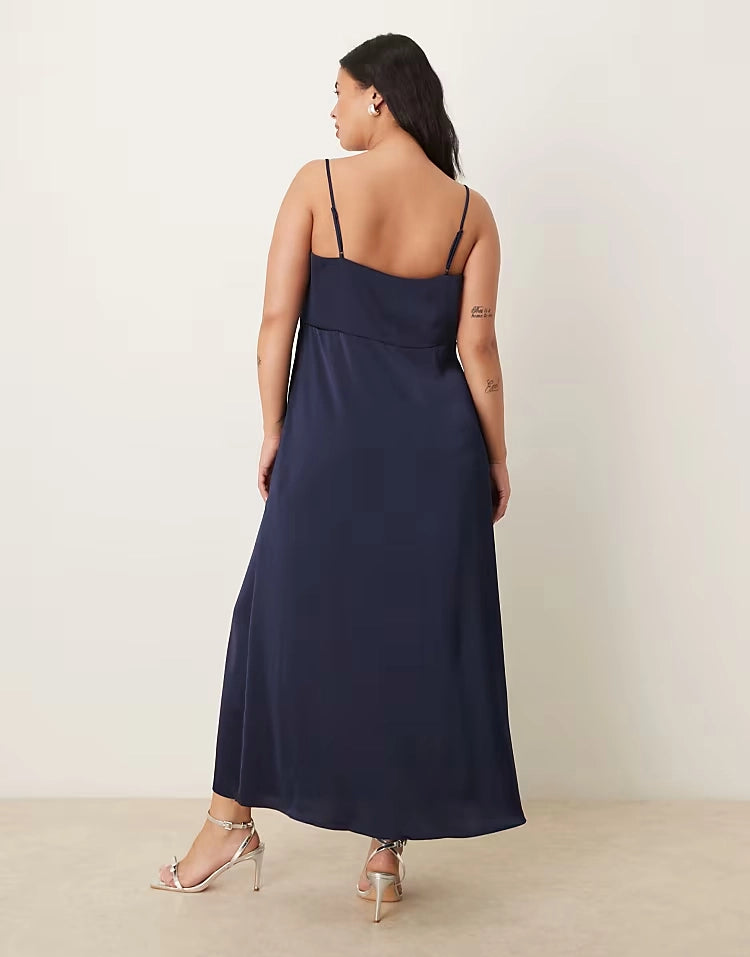 Back view of roselledress dark navy open‑back empire‑line plus size flowy maxi formal gown
