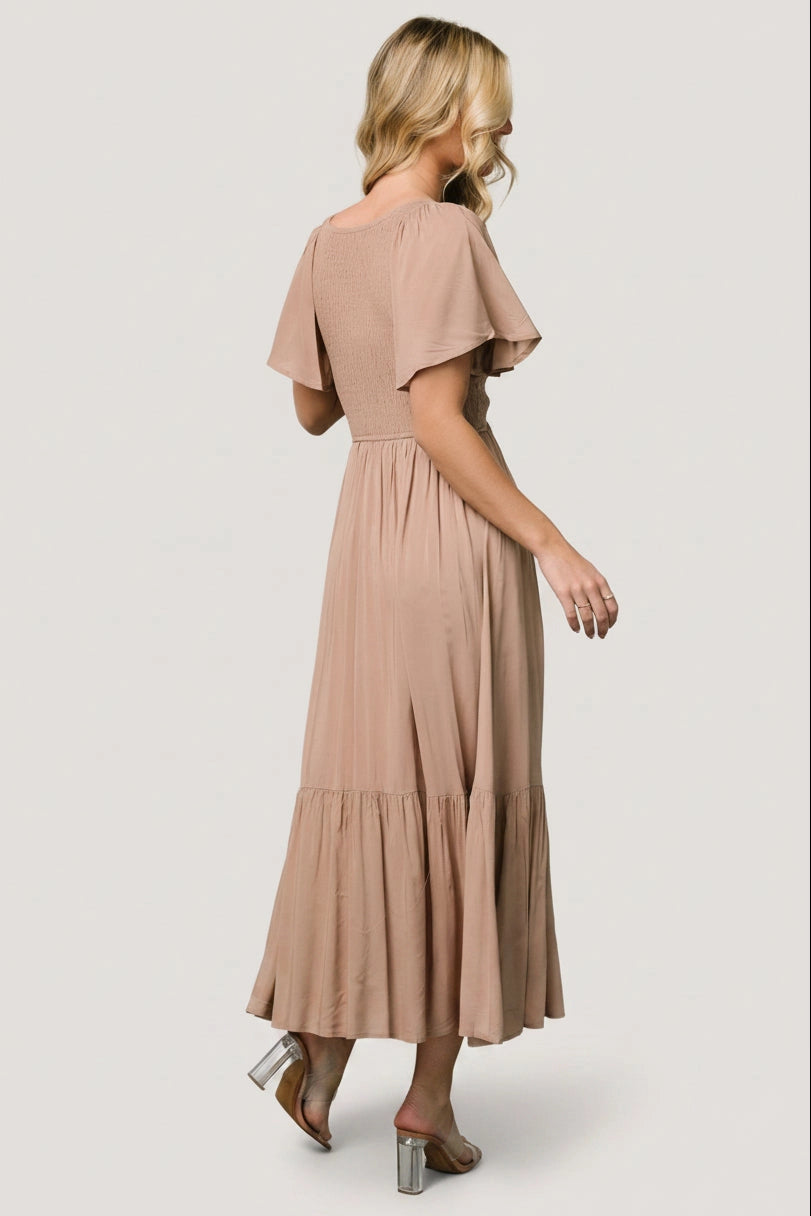 Roselledress neutral taupe tiered midi dress full smocked back formal gown rear view