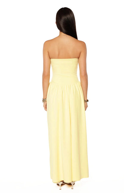 RoselleDress butter yellow stretch knit strapless open back flowy long wedding guest gown