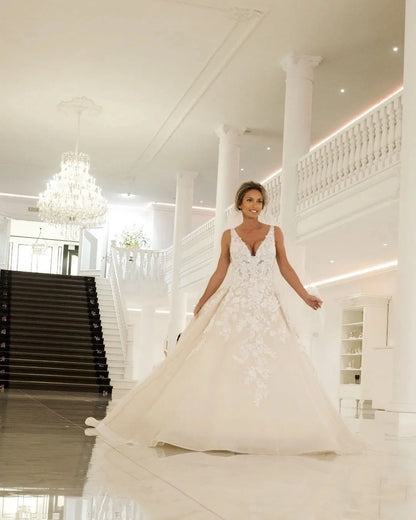 Elegant Ball‑Gown Deep‑V Sleeveless Deep‑U‑Back Train Plus Size Wedding Dress