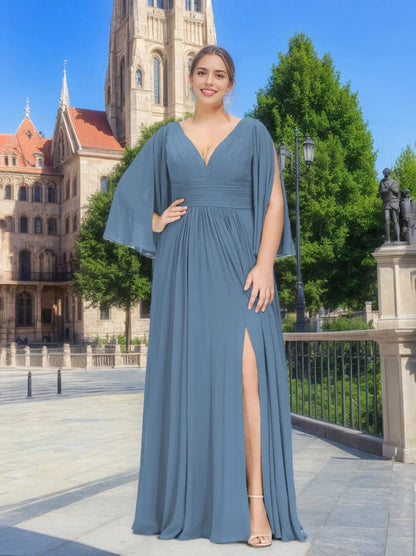 RoselleDress dusty blue plus size bridesmaid dress deep V neck flutter cape sleeves ruched waist high side slit flowy chiffon formal gown