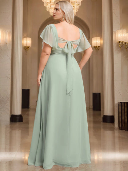 Back view of RoselleDress mint green curvy chiffon formal dress square cutout self tie bow back short sleeve maxi bridesmaid dress