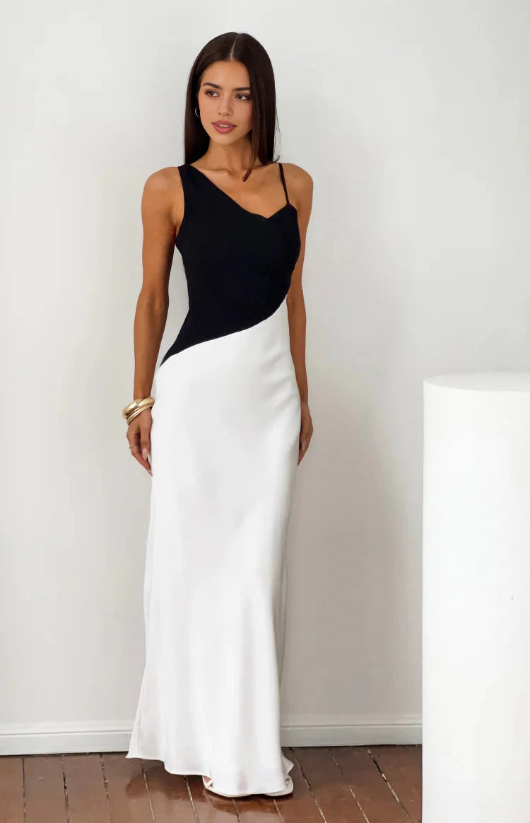 RoselleDress black white colorblock mermaid evening dress asymmetrical v neck indoor white wall shot