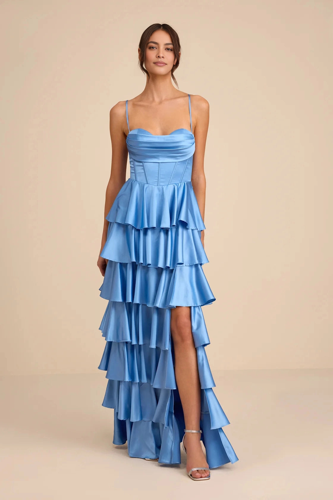 roselledress pastel light blue glossy satin ultra thin spaghetti cowl draped corset boned bodice tiered layered ruffle high low high thigh slit long prom gown neutral beige studio front full shot