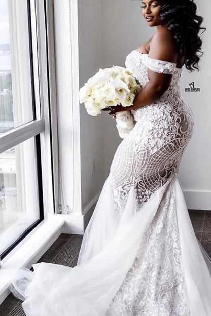Curvy bride wearing Roselledress illusion back plus‑size lace mermaid wedding dress chapel train