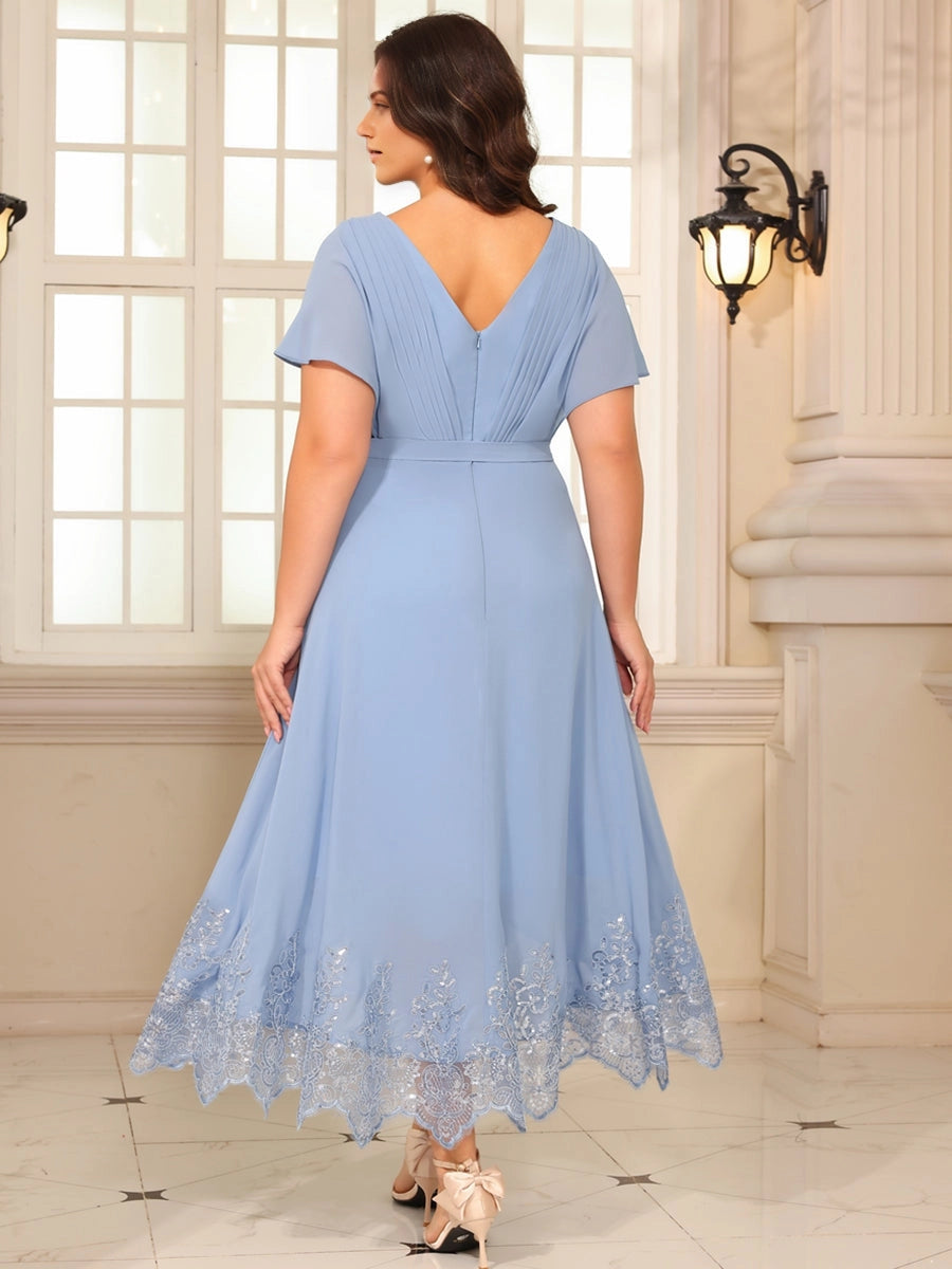 Model wearing roselledress dusty‑blue plus‑size chiffon wedding guest dress v‑back zipper‑back rear view