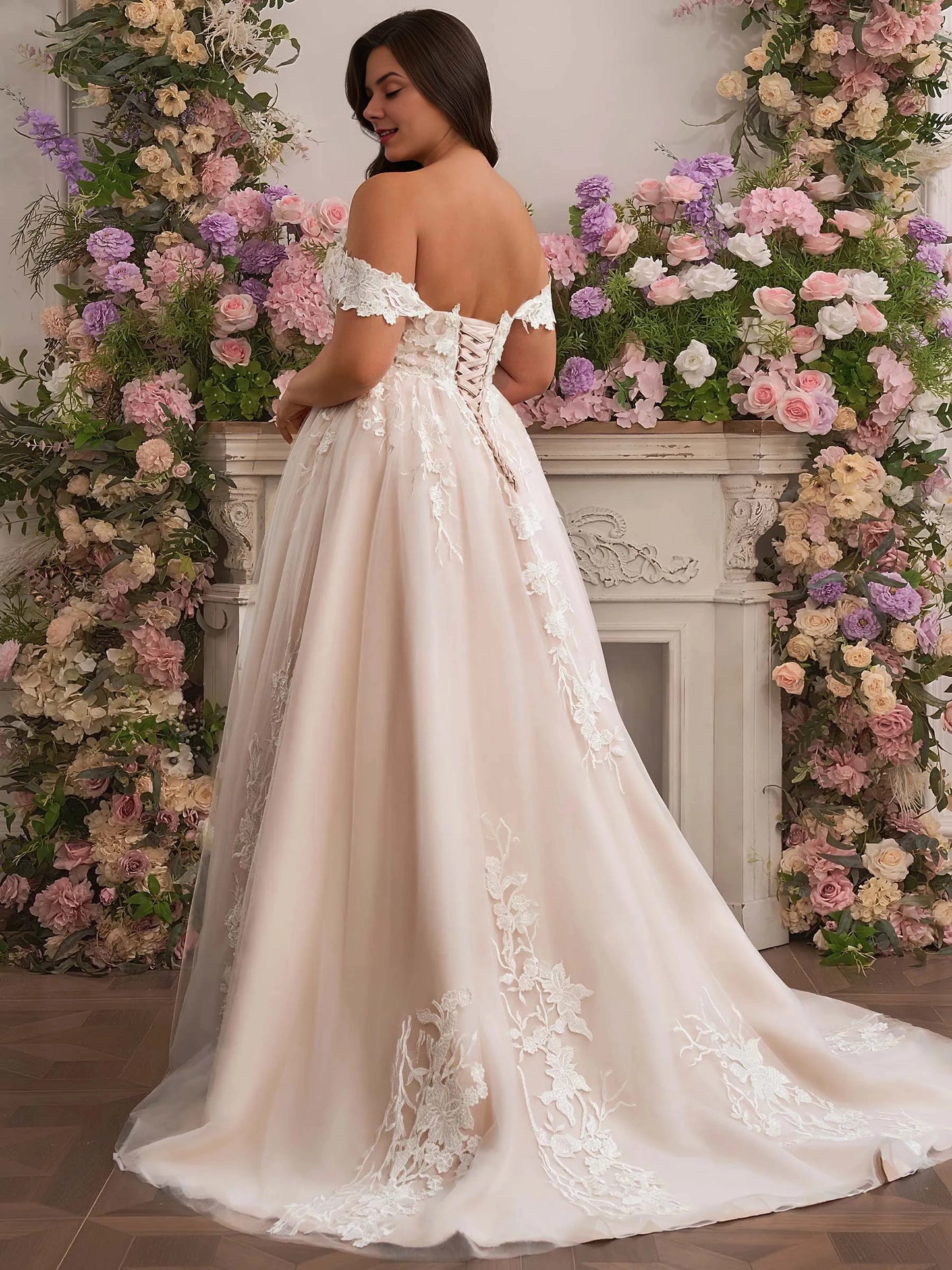 Curvy bride wearing Roselledress corset lace‑up back plus‑size lace wedding dress back view