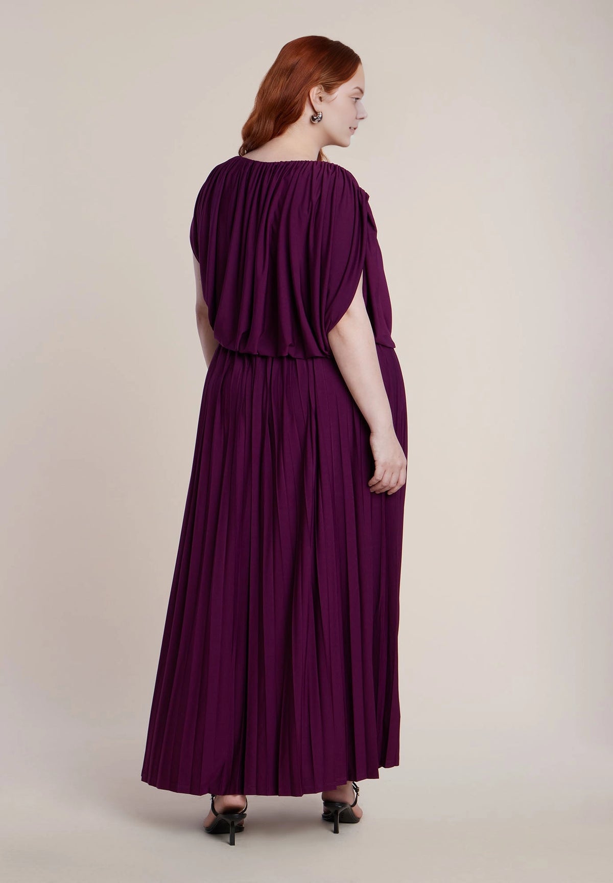 roselledress plum purple pleated maxi dress cape draped sleeve elastic boat neck cut‑out waist plus size formal wedding guest dress back view