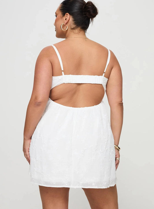 Plus size white chiffon homecoming dress featuring open back cutout and thin straps
