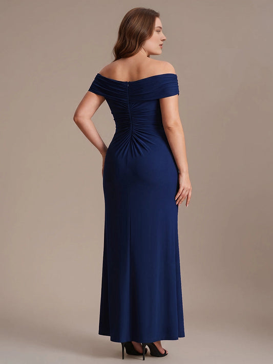 Navy plus size evening gown back view, off the shoulder neckline, fully ruched back, center back zipper and fitted long skirt
