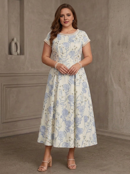 Roselledress blue floral plus size wedding guest dress front view, pearl trim round neck short sleeve a-line textured midi gown