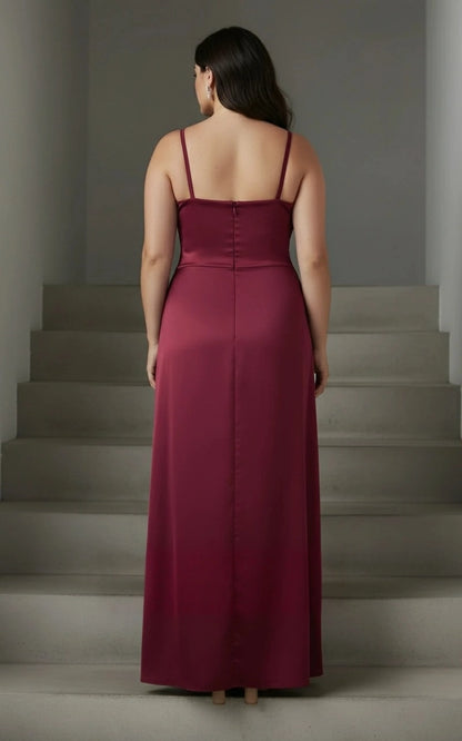 Burgundy plus size wedding guest dress with thin shoulder straps, straight back neckline, center zipper and flowing floor-length column skirt