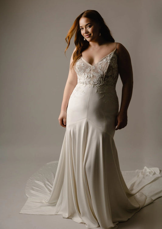 Ivory plus size mermaid wedding dress with floral lace V-neck bodice, spaghetti straps, fitted silhouette and flowing floor-length skirt
