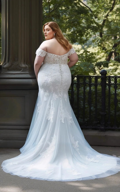 Ivory plus size mermaid wedding dress with floral lace appliques, button-style back detailing and flowing tulle train