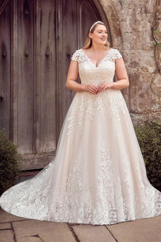 Ivory plus size A-line wedding dress with V-neckline, floral lace cap sleeves, fitted embroidered bodice and flowing tulle skirt