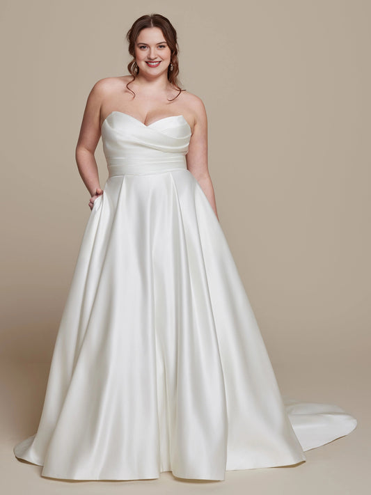 Ivory plus size A-line wedding dress with strapless sweetheart neckline, pleated satin-look bodice, defined waist and flowing skirt with pockets