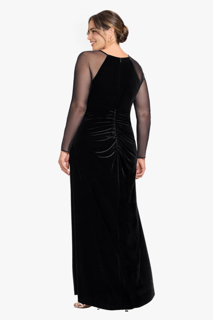 Back view of black plus size velvet wedding guest dress featuring sheer mesh sleeves, center zipper, ruched waist and floor-length skirt by roselledress