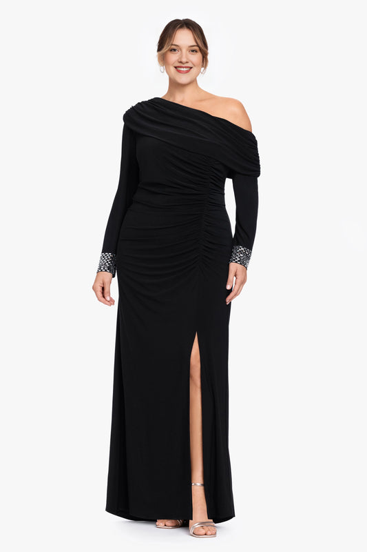 Black plus size wedding guest dress with asymmetric off shoulder neckline, long sleeves, beaded cuffs, ruched waist and front slit by roselledress