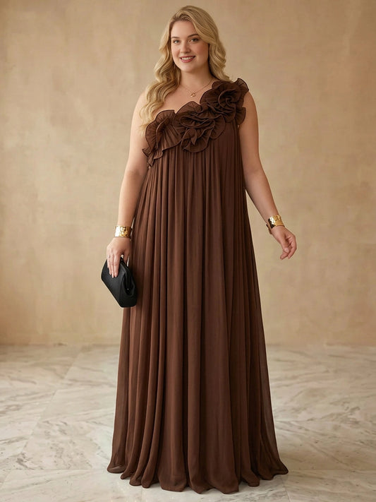 Plus size chocolate brown chiffon one-shoulder wedding guest dress with 3D ruffle flower trim, empire waist and pleated floor length skirt, front view
