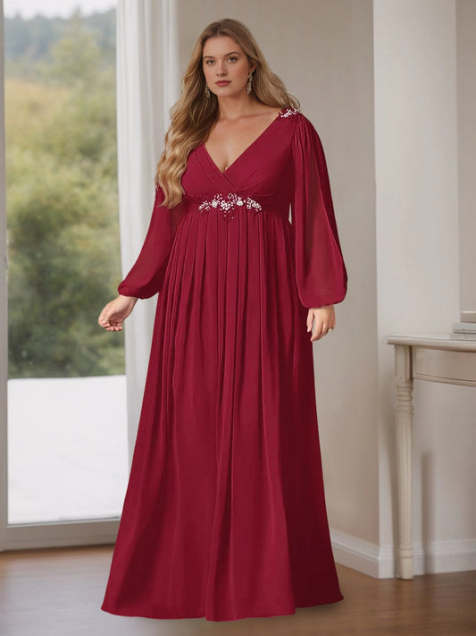 Plus size burgundy chiffon mother of the bride dress with V-neck wrap bodice, beaded embroidery at shoulders and waist, sheer balloon long sleeves and flowing floor length skirt, front view
