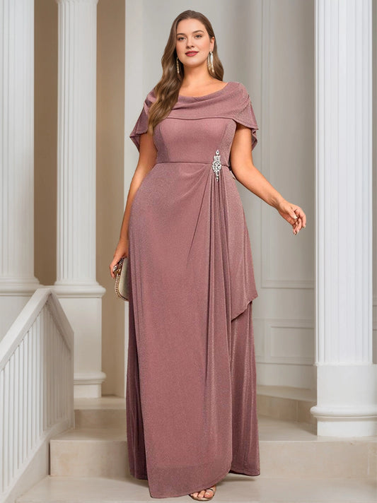 Plus size dusty rose cowl neck mother of the bride dress with rhinestone brooch at waist, draped side slit and long flowing skirt, front view
