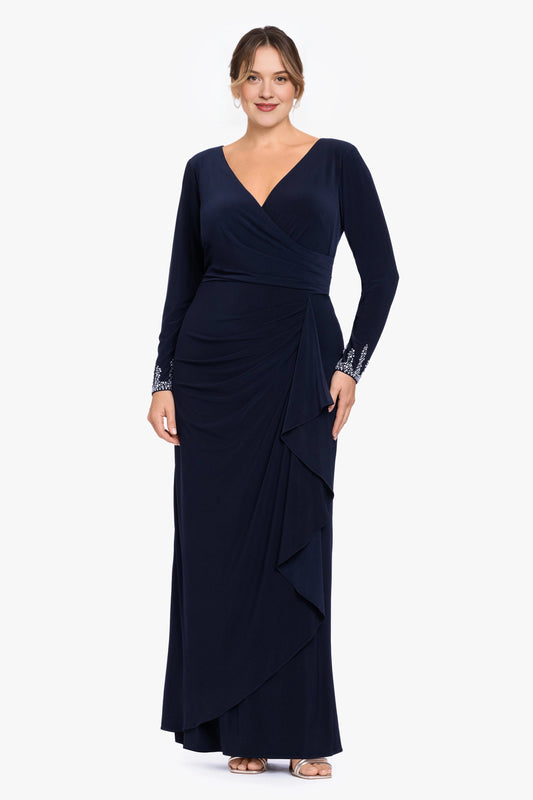 Navy blue plus size mother of the bride dress with V-neckline, long sleeves, beaded cuffs, ruched waist and cascading side ruffle by roselledress