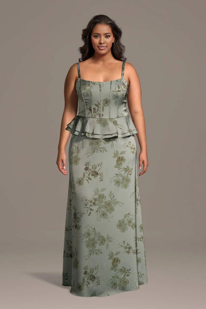 Plus size sage green floral satin wedding guest dress with square neck, thin straps, corset bodice, peplum waist and long slip skirt, front view
