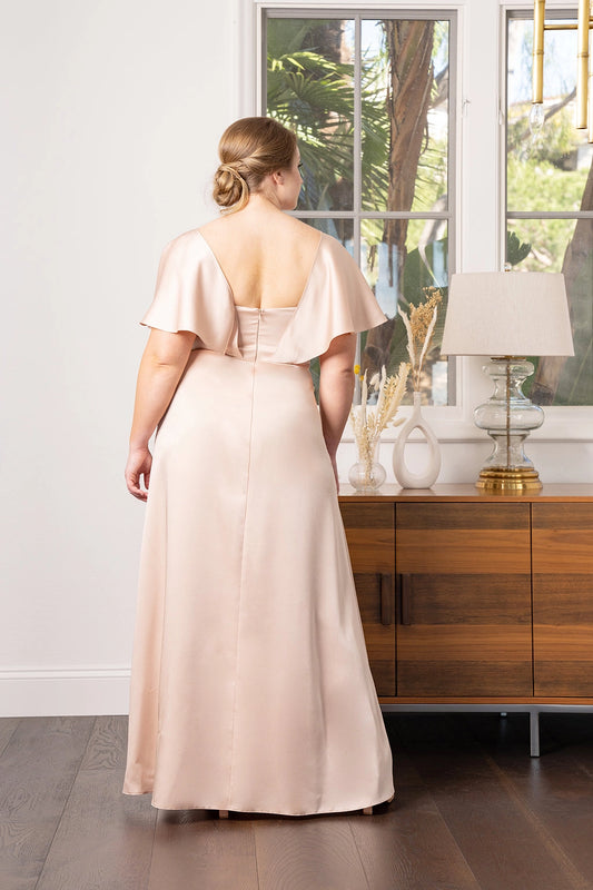 Back view of champagne plus size bridesmaid dress featuring flutter sleeves, open V-back, center zipper and floor-length skirt by roselledress