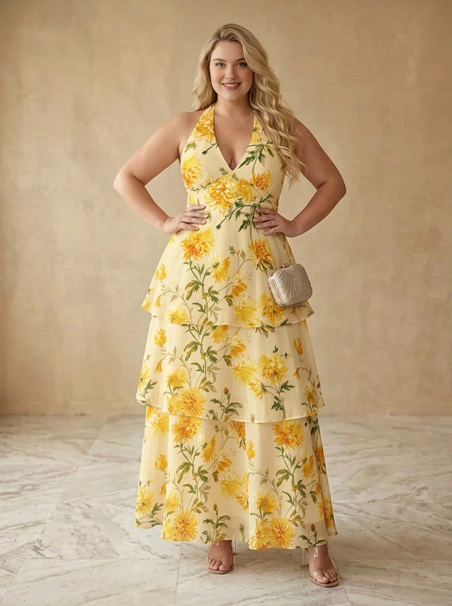 Plus size yellow floral chiffon wedding guest dress with halter V-neck, tiered ruffle skirt and open back, front view
