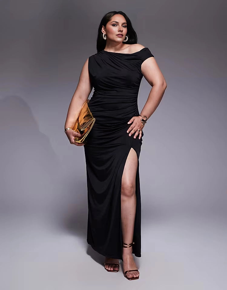 Roselledress plus size black stretch ruched one‑shoulder cap sleeve maxi wedding guest dress front view with high slit on curvy model