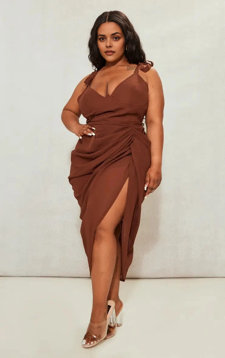 Roselledress plus size brown chiffon draped tie‑strap v‑neck midi wedding guest dress with high slit front view on curvy model