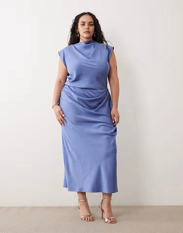 Roselledress plus size blue satin draped cowl neck cap sleeve midi wedding guest dress front view on curvy model