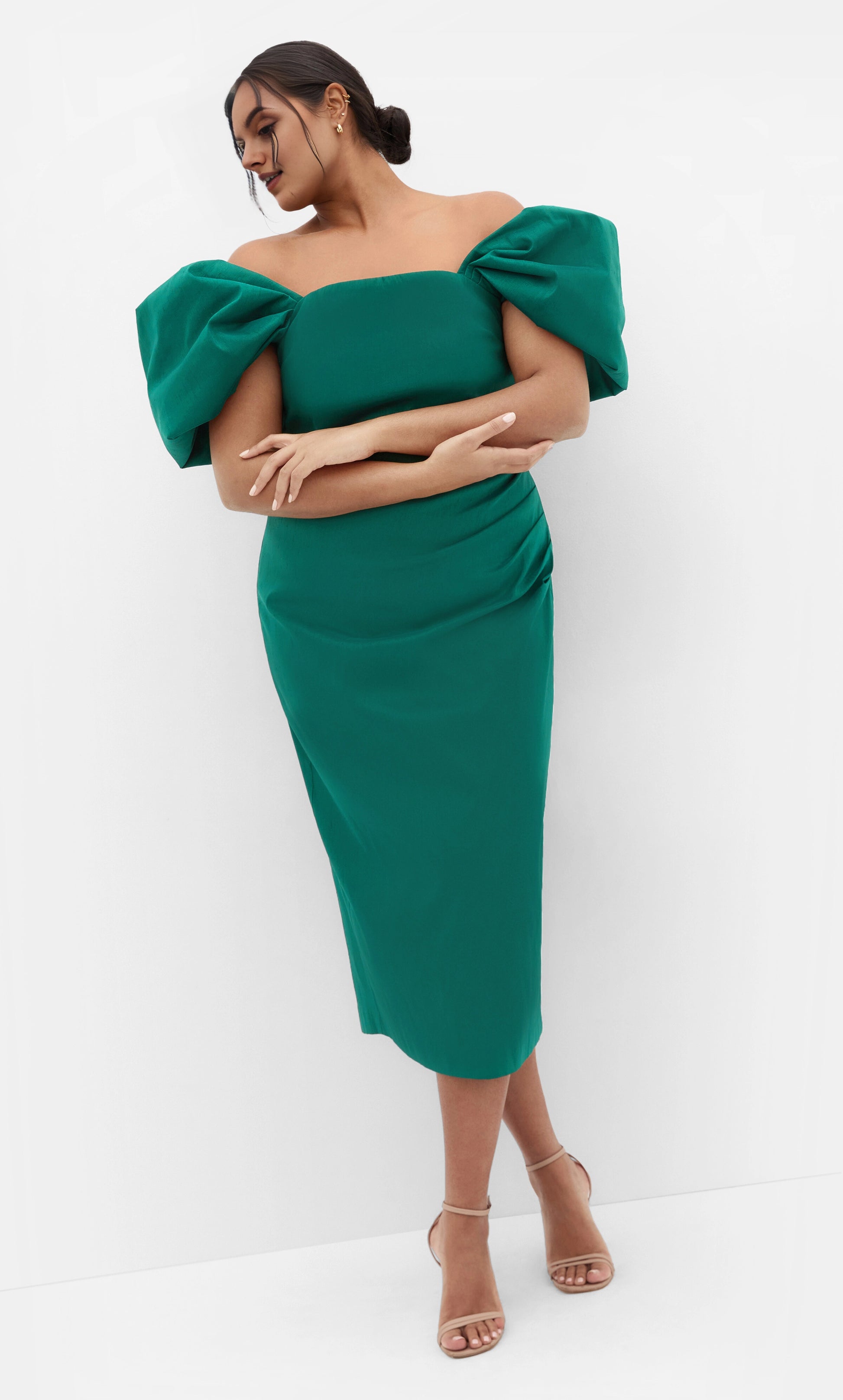 RoselleDress emerald green plus size wedding guest midi dress off‑the‑shoulder dramatic puff sleeve side ruched sheath dress front view cocktail formal gown